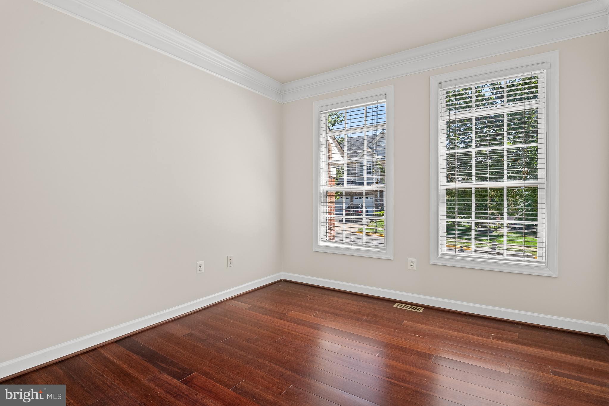 16862 Reef Knot Way Woodbridge, VA 22191 - Photo 5 of 99 an empty room with wooden floor and windows