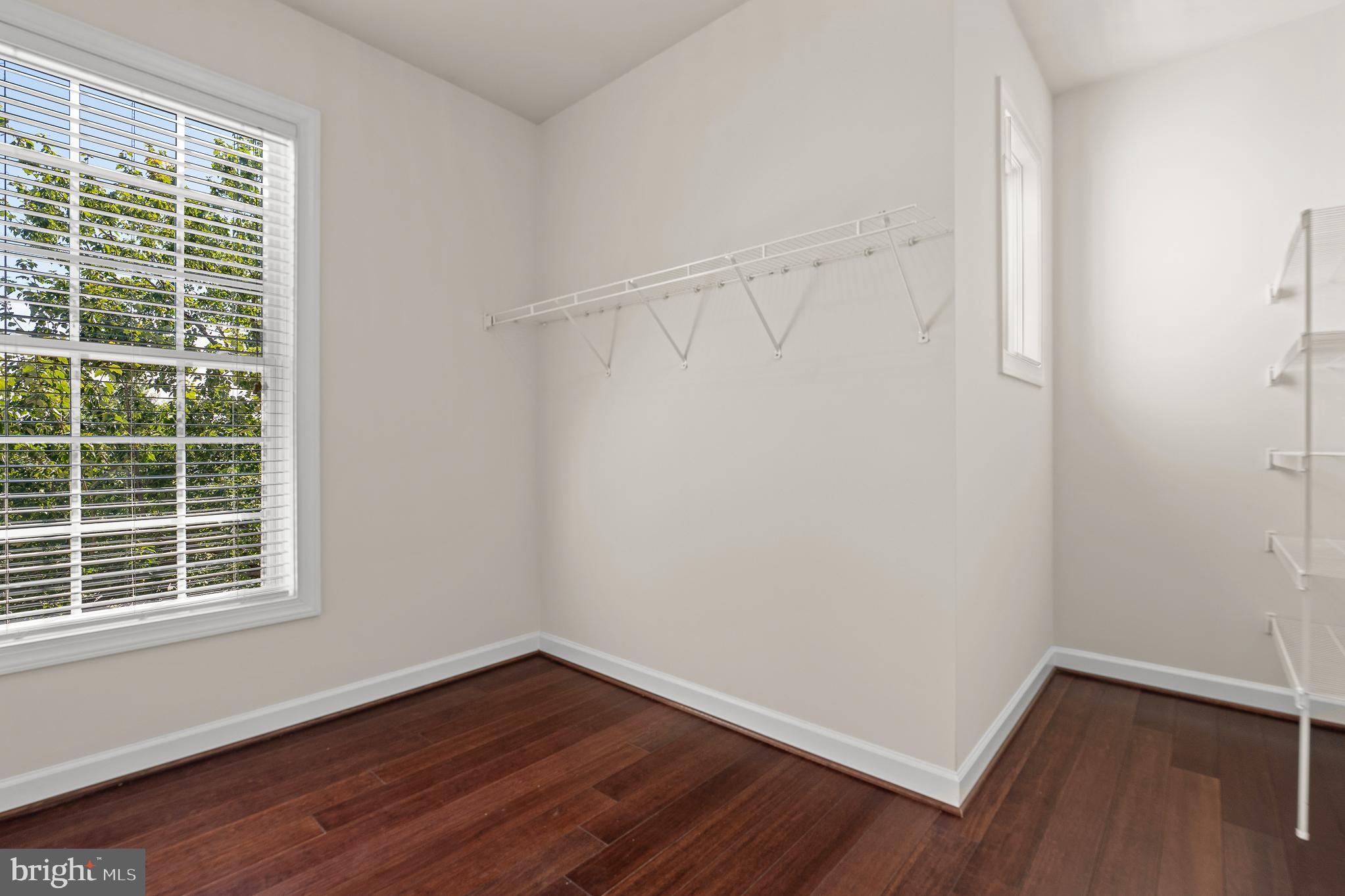 16862 Reef Knot Way Woodbridge, VA 22191 - Photo 53 of 99 a view of an empty room with wooden floor and a window
