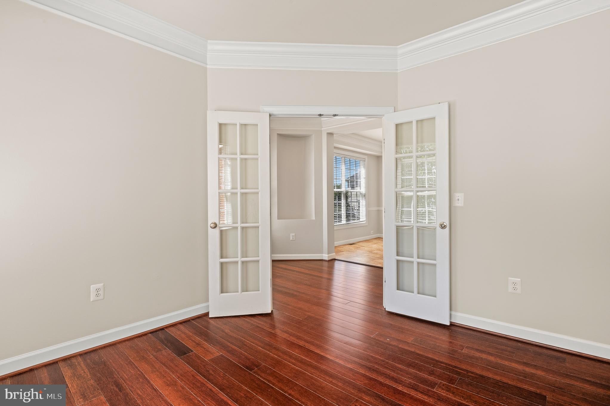 16862 Reef Knot Way Woodbridge, VA 22191 - Photo 6 of 99 an empty room with wooden floor and windows