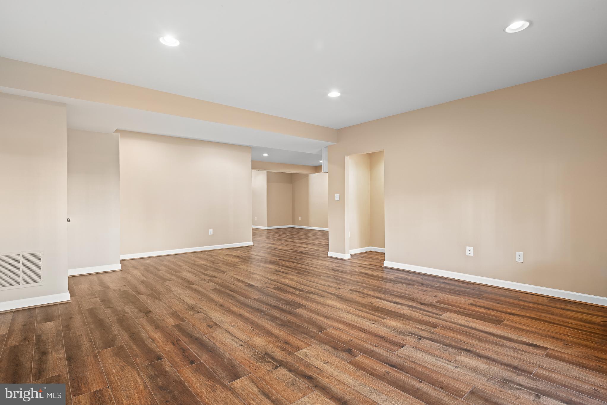 16862 Reef Knot Way Woodbridge, VA 22191 - Photo 61 of 99 a view of an empty room with wooden floor
