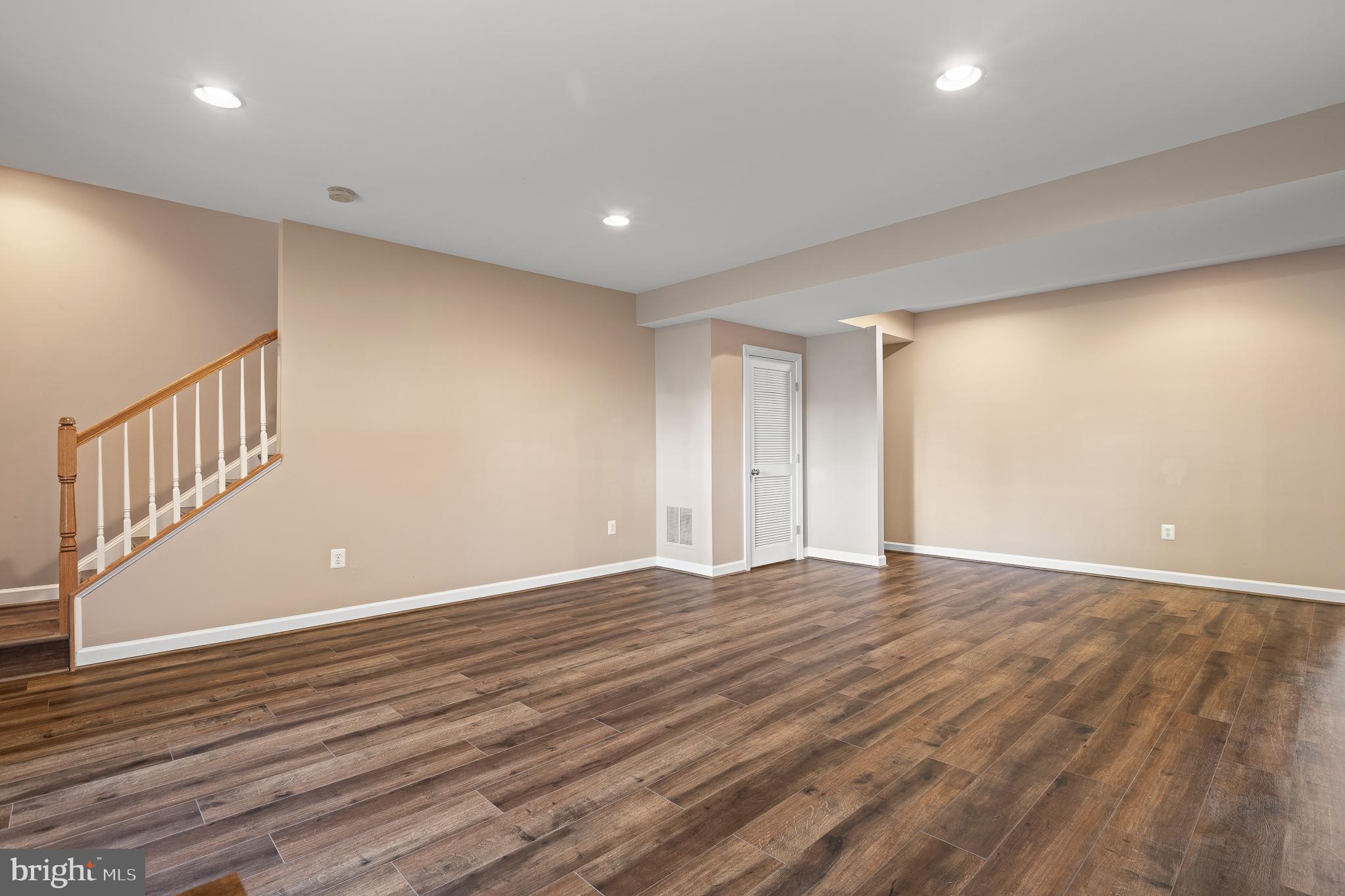 16862 Reef Knot Way Woodbridge, VA 22191 - Photo 62 of 99 a view of an empty room with wooden floor