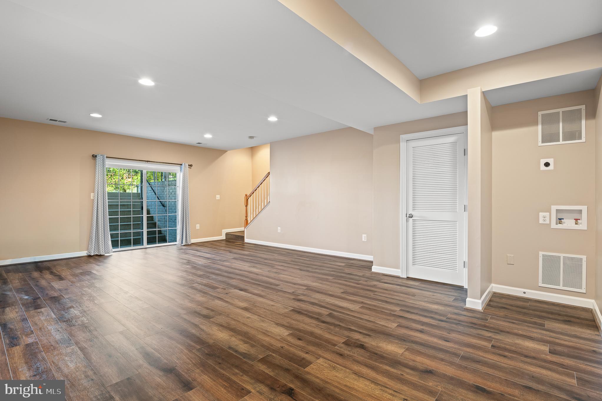 16862 Reef Knot Way Woodbridge, VA 22191 - Photo 66 of 99 a view of an empty room with wooden floor and windows