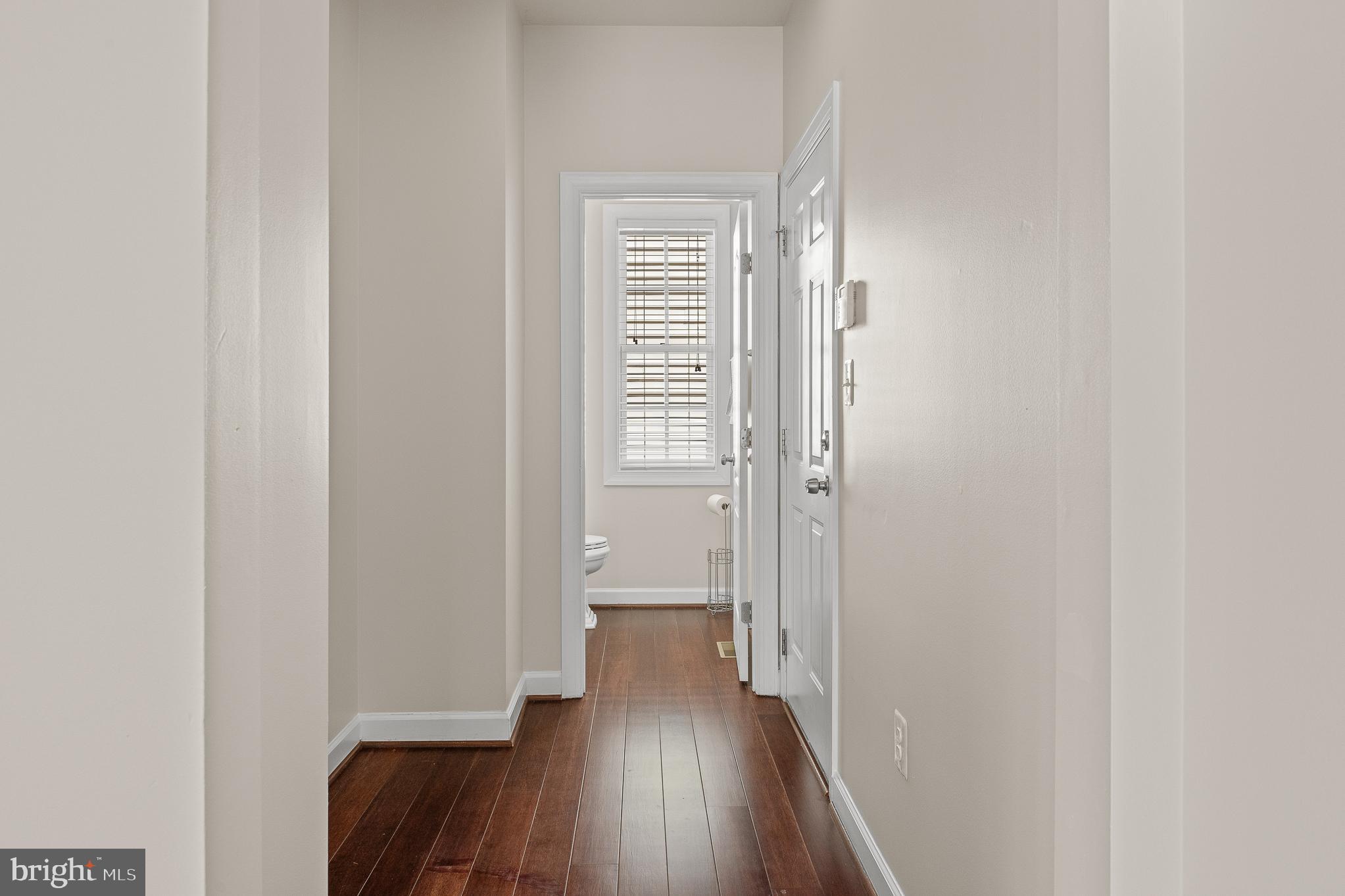 16862 Reef Knot Way Woodbridge, VA 22191 - Photo 10 of 99 a view of a hallway with wooden floor