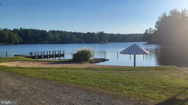 a view of a swimming pool and a yard