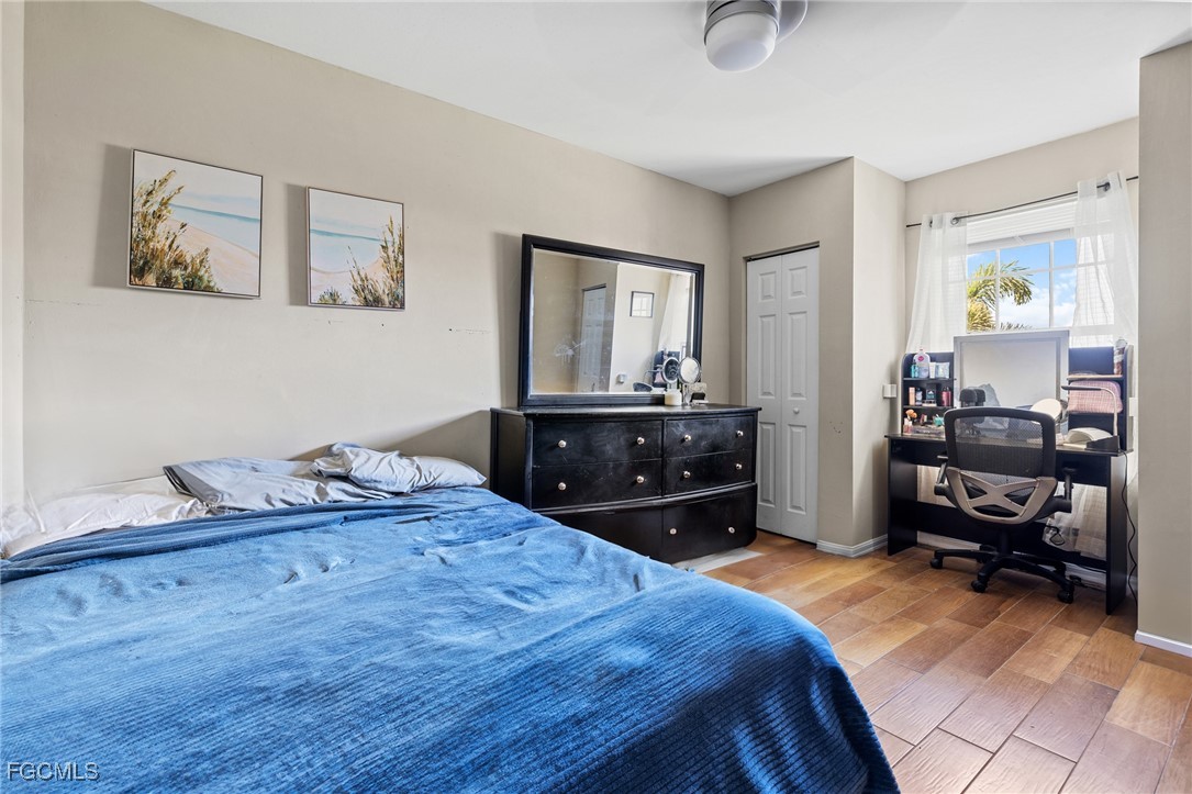 8657 Sumner Avenue Fort Myers, FL 33908 - Photo 18 of 29 a bedroom with a bed and a dresser