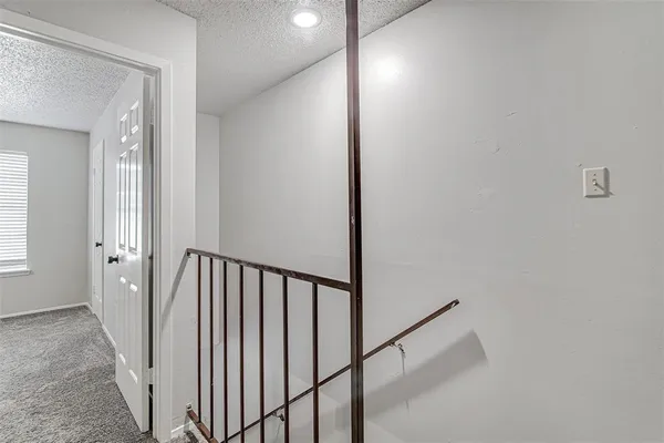 a view of a hallway with a window