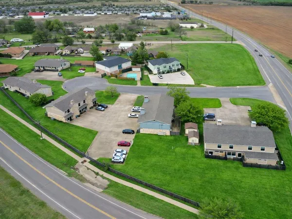 a view of a play ground with a small yard