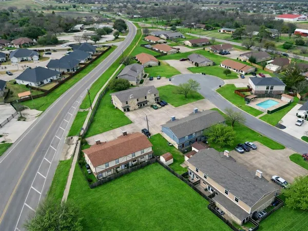 an aerial view of a house with a garden