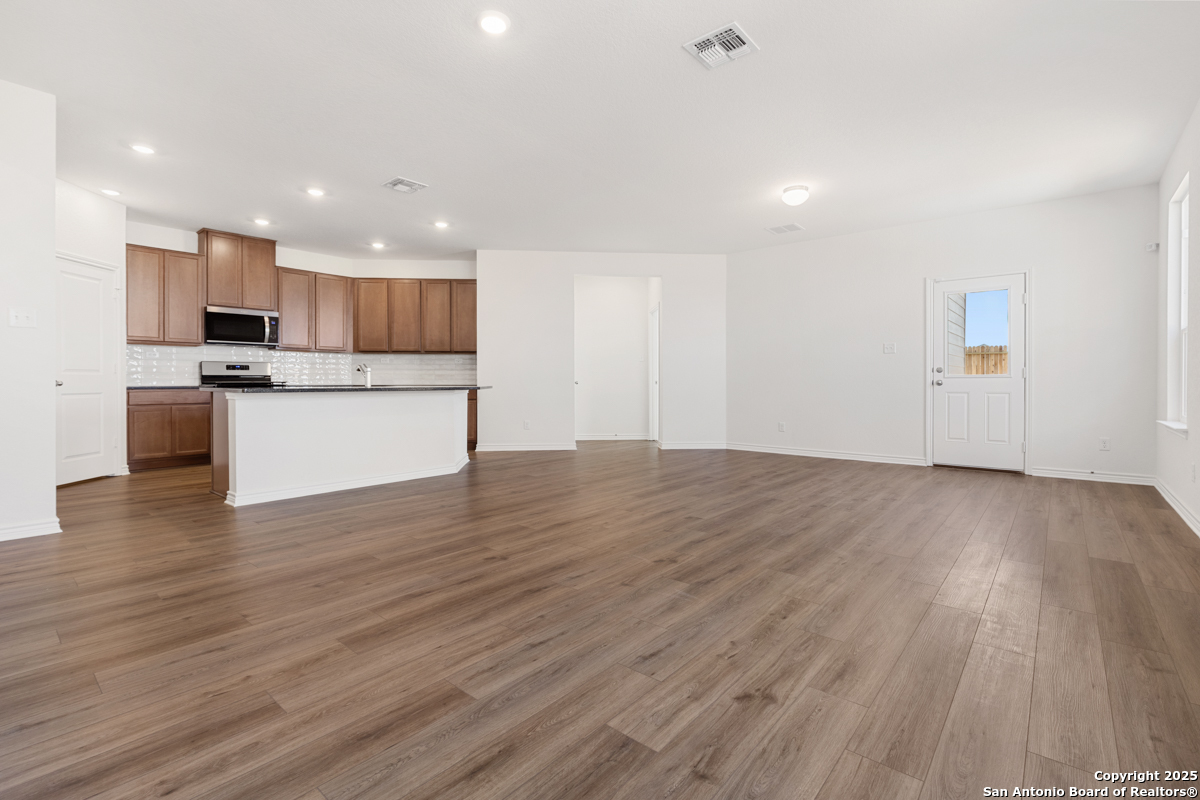 10034 Jagger Avenue Converse, TX 78109 - Photo 4 of 6 a view of kitchen with wooden floor and electronic appliances