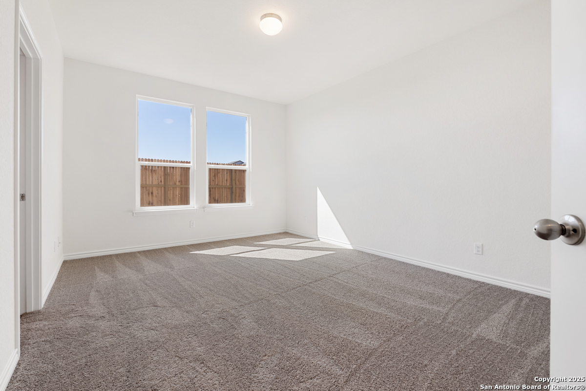 10034 Jagger Avenue Converse, TX 78109 - Photo 6 of 6 a view of empty room with windows
