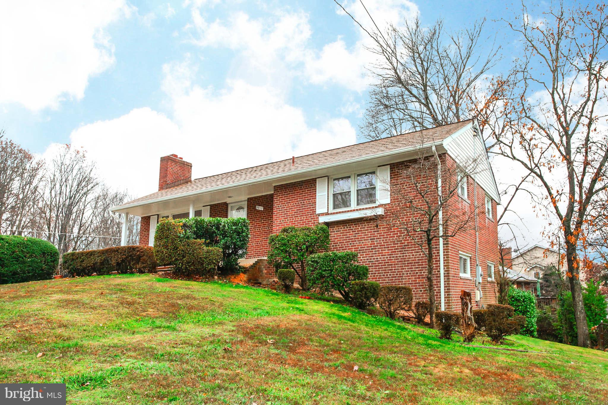 5917 Atteentee Road Springfield, VA 22150 - Photo 1 of 30 a front view of house with yard and green space