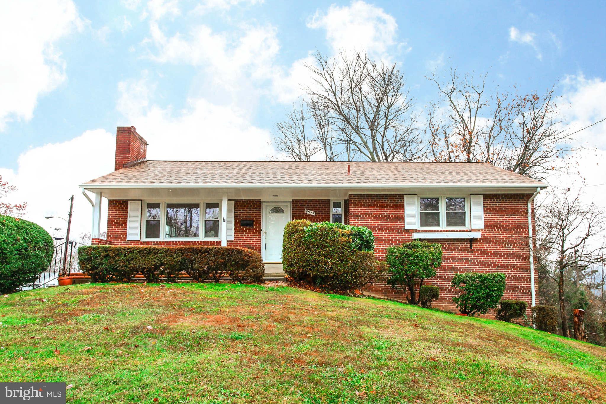 5917 Atteentee Road Springfield, VA 22150 - Photo 2 of 30 a front view of a house with garden