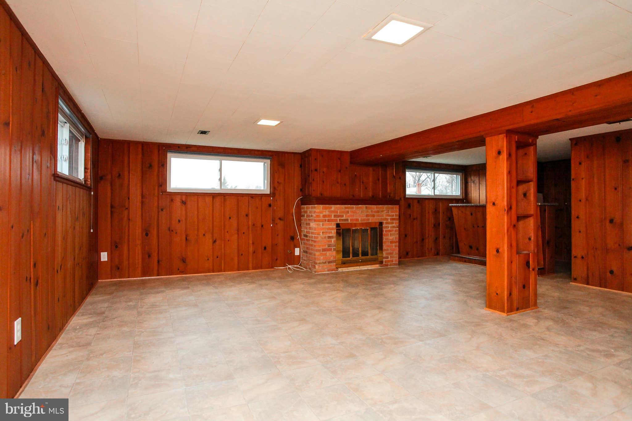5917 Atteentee Road Springfield, VA 22150 - Photo 18 of 30 an empty room with furniture and a fireplace