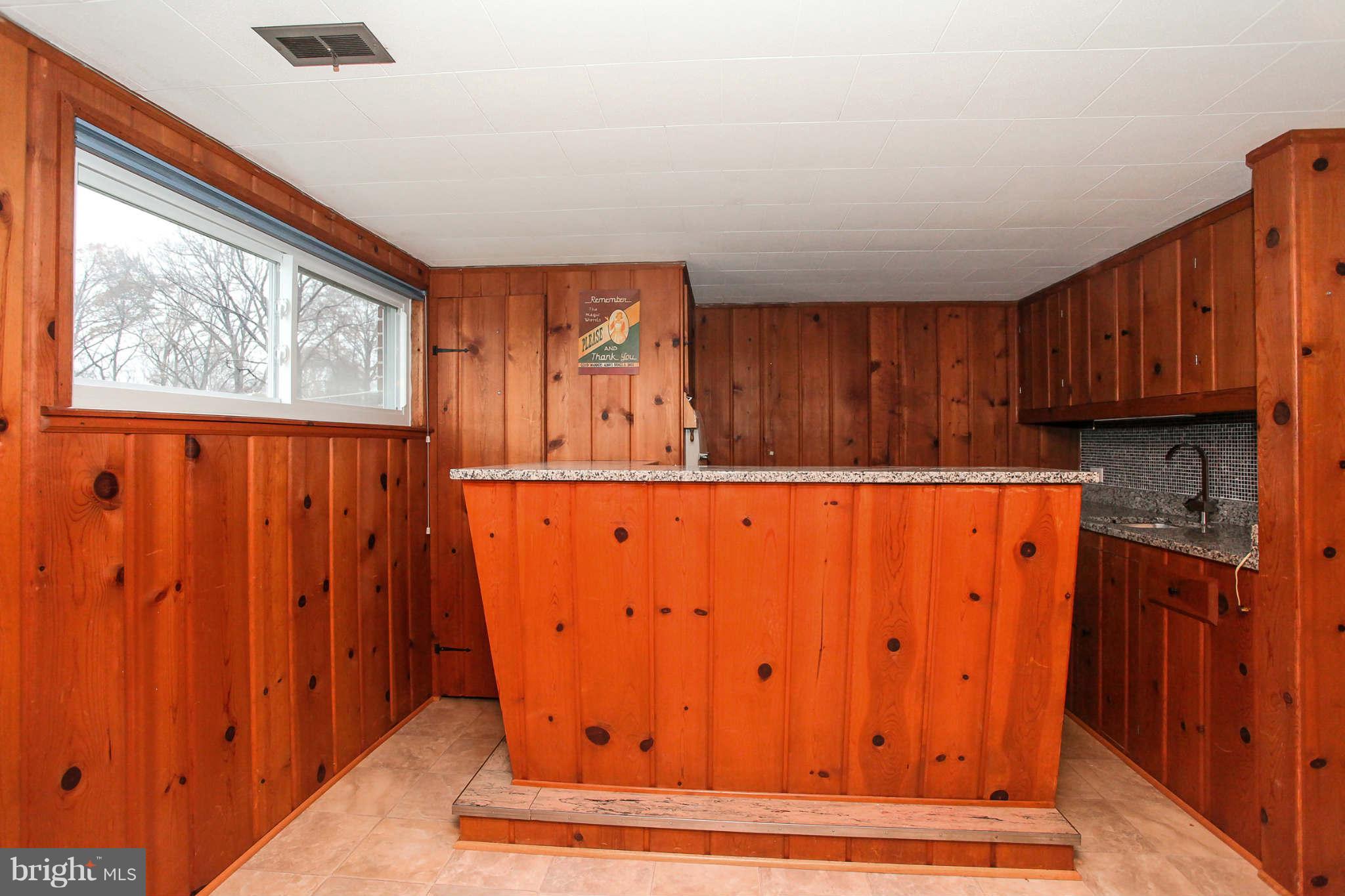 5917 Atteentee Road Springfield, VA 22150 - Photo 20 of 30 a view of kitchen with wooden walls