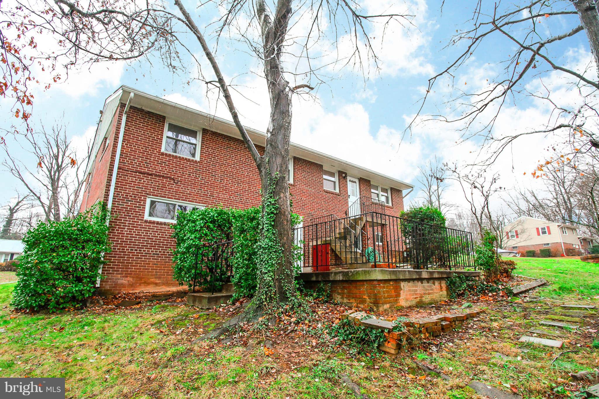 5917 Atteentee Road Springfield, VA 22150 - Photo 28 of 30 a view of a house with a yard and a tree