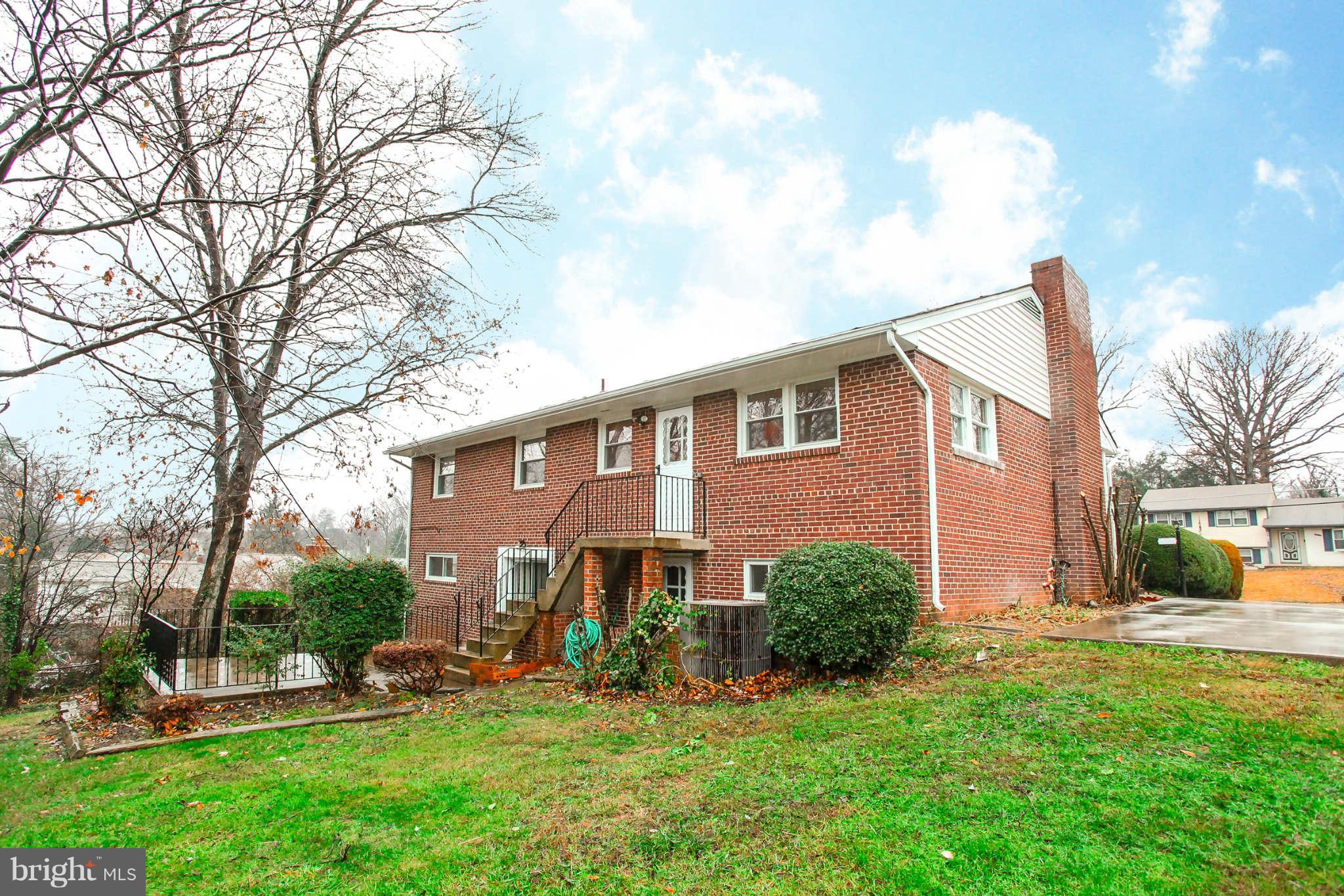 5917 Atteentee Road Springfield, VA 22150 - Photo 29 of 30 a view of a house with a yard and plants