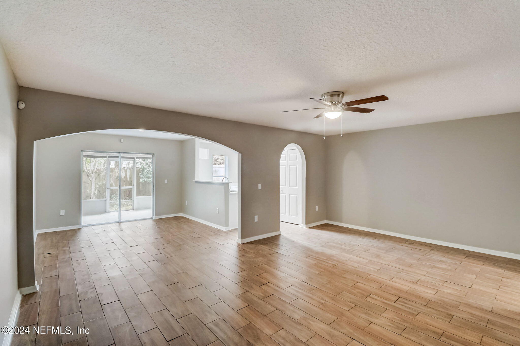 794 Bent Baum Road Jacksonville, FL 32205 - Photo 2 of 13 a view of an empty room with window and wooden floor