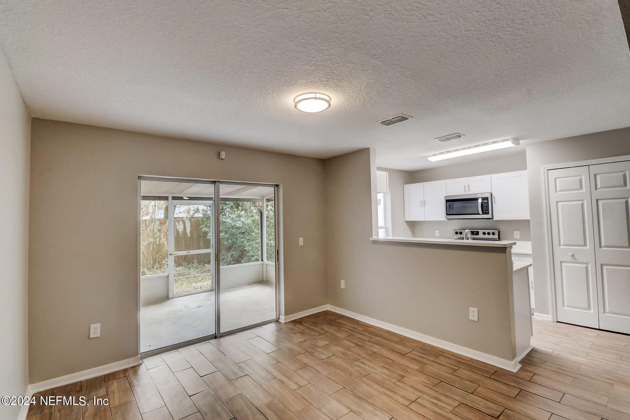 794 Bent Baum Road Jacksonville, FL 32205 - Photo 4 of 13 a view of kitchen with wooden floor and electronic appliances