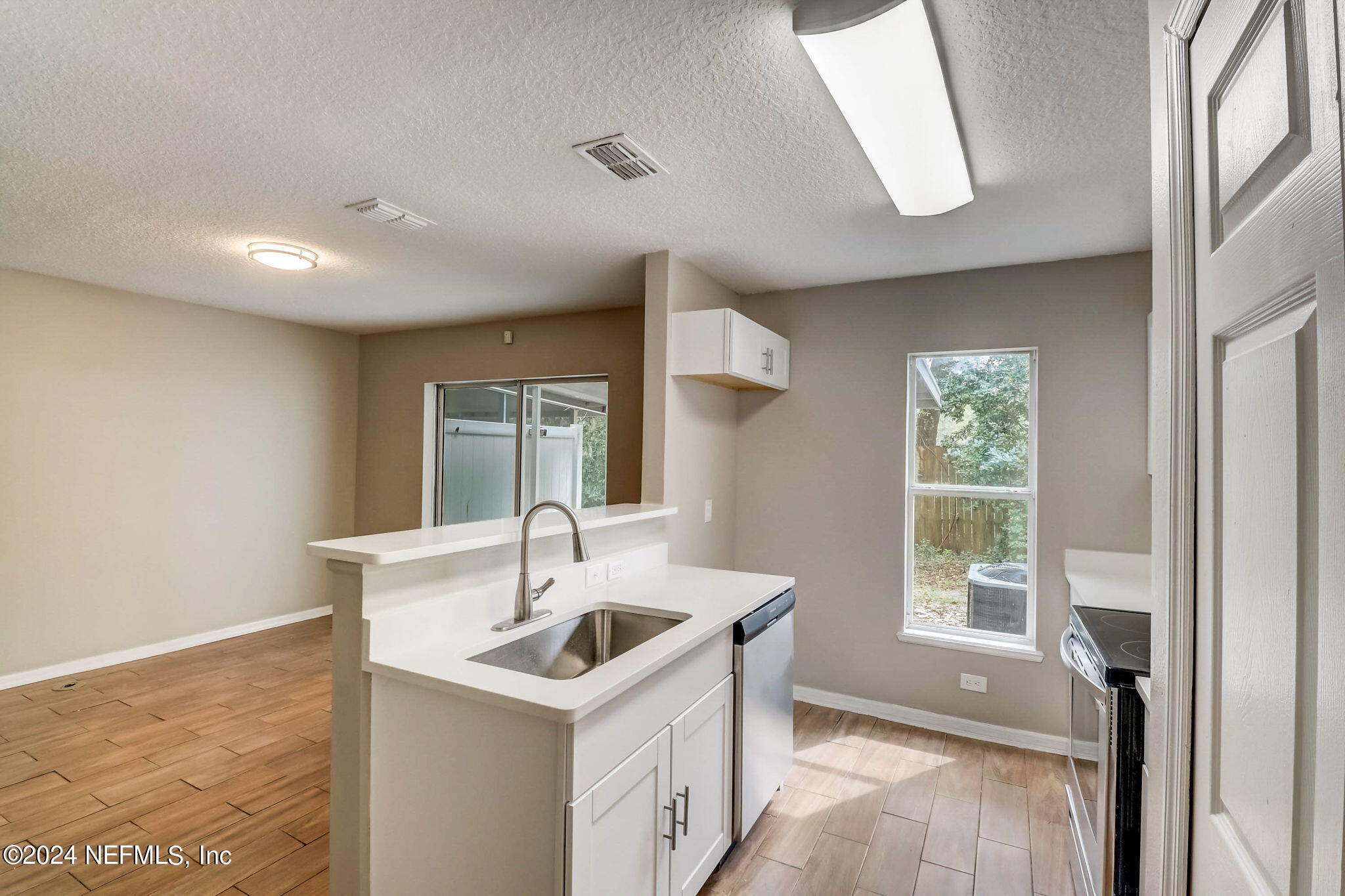 794 Bent Baum Road Jacksonville, FL 32205 - Photo 5 of 13 a kitchen with a sink and a window