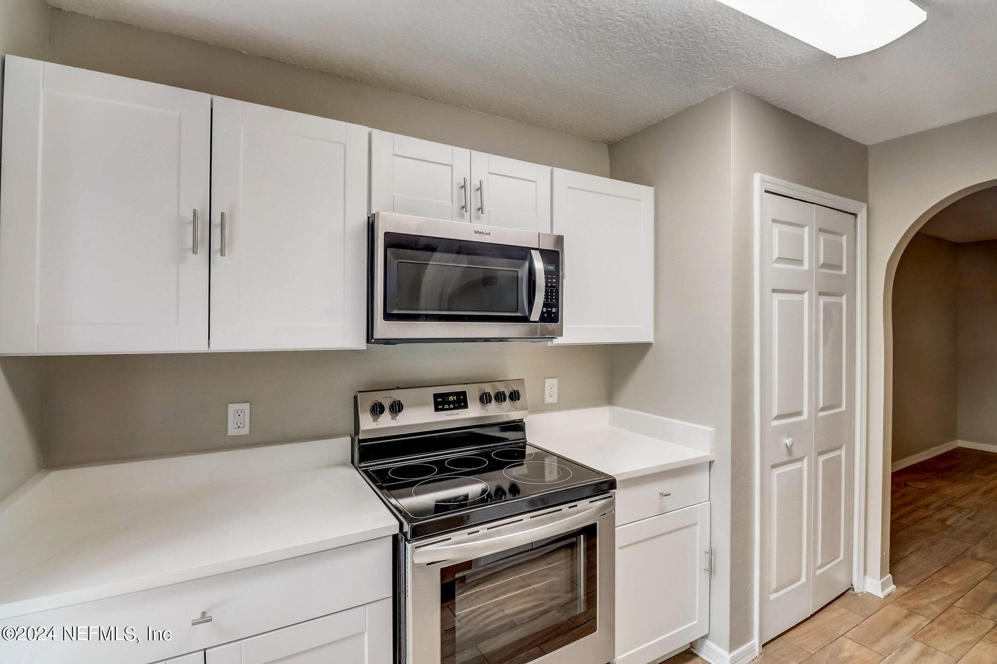 794 Bent Baum Road Jacksonville, FL 32205 - Photo 6 of 13 a kitchen with a stove and a microwave