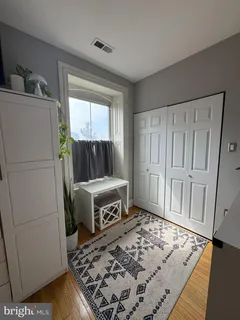 a bedroom with a bed and a window in it
