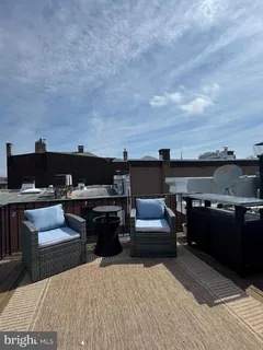 a view of balcony and yard