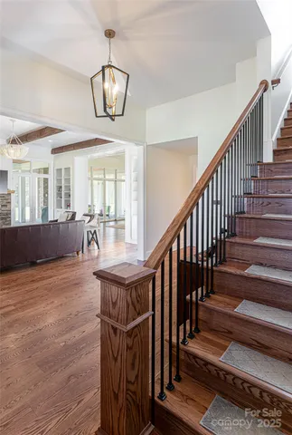 a view of an entryway and wooden floor