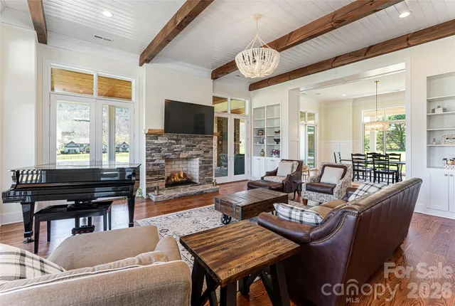 a living room with fireplace furniture and a flat screen tv