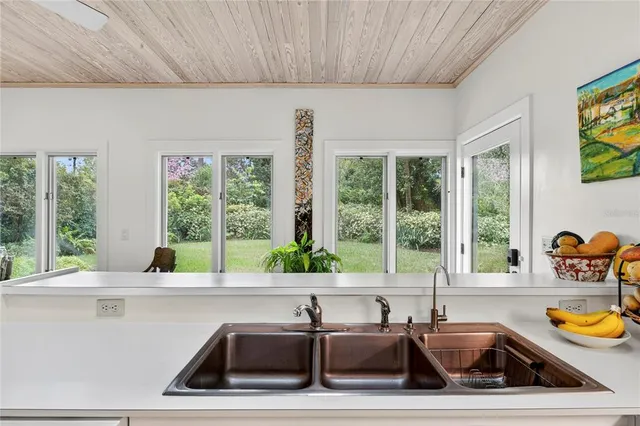 a bedroom with furniture and a flat screen tv