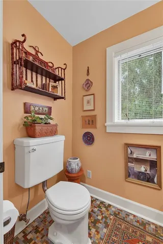 a view of walk in closet with clothes