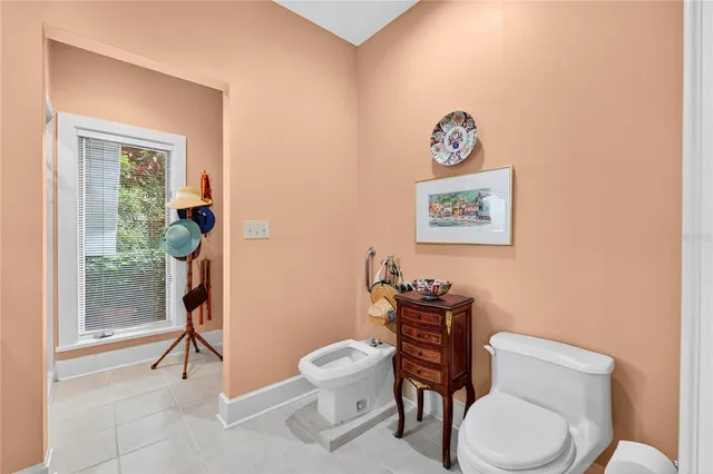 a bedroom with furniture and a window