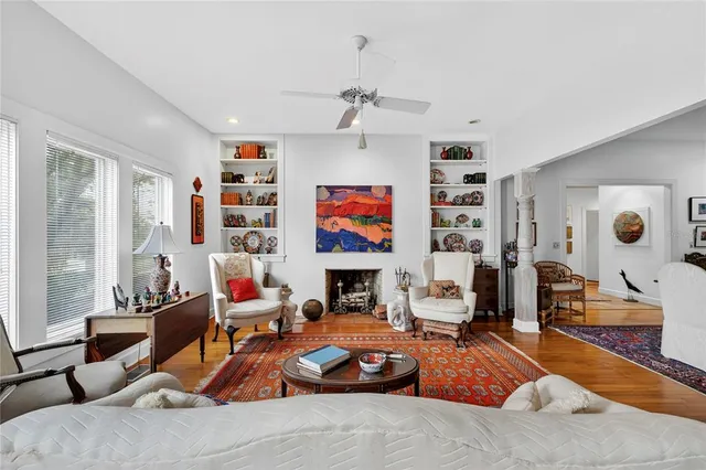 a living room with furniture and a fireplace