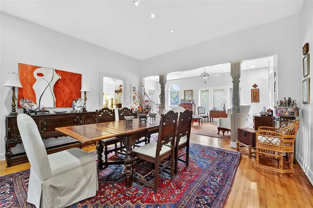 a living room with patio furniture and a large window