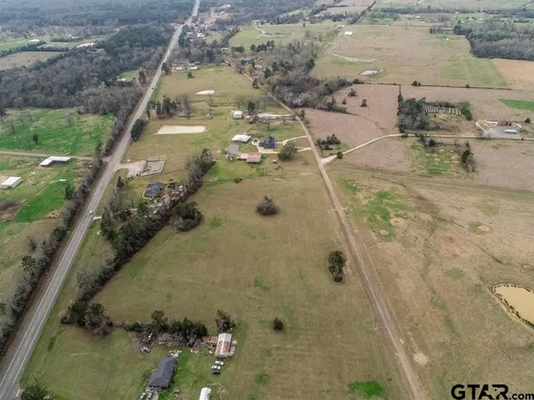 an aerial view of a house with outdoor space