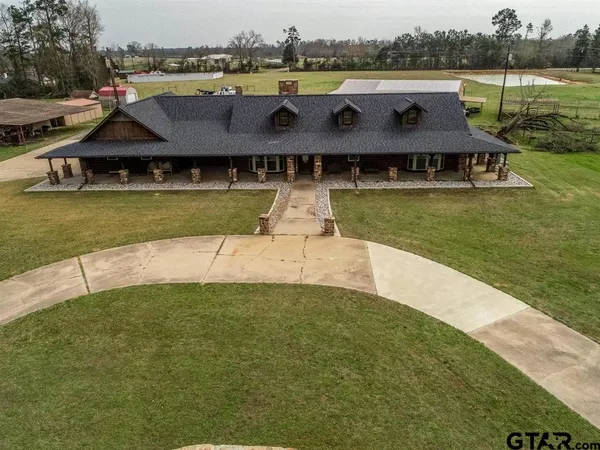 a front view of a house with swimming pool