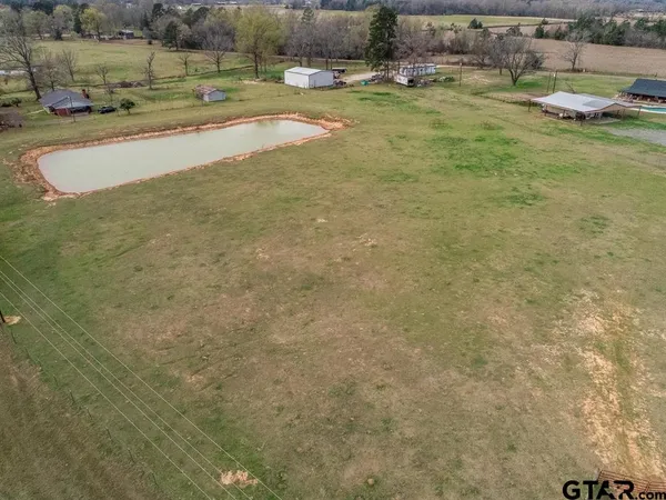 an aerial view of a house with outdoor space