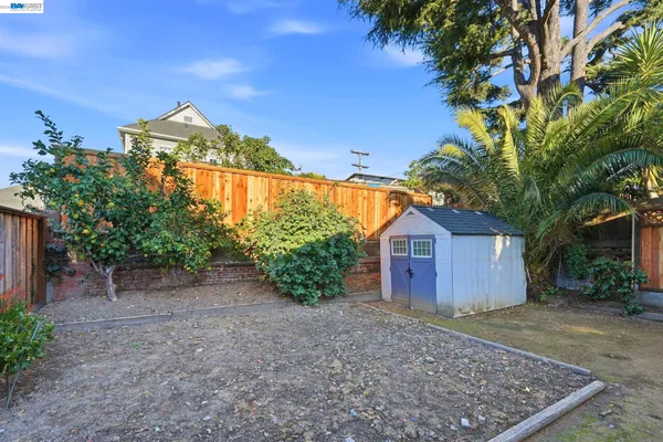 a view of a house with backyard sitting area and tub