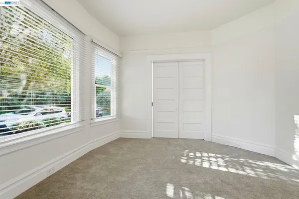 a view of an empty room and window
