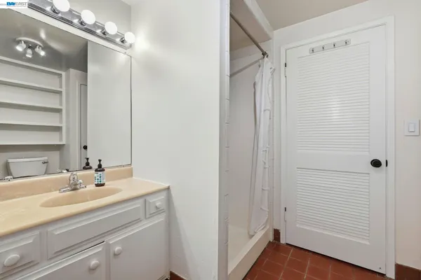 a bathroom with a shower and a shower