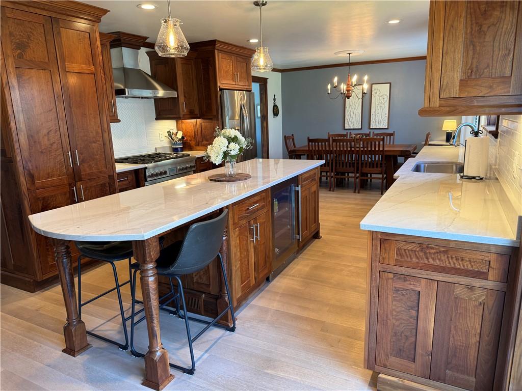 111 McCall Road Butler, PA 16001 - Photo 14 of 50 a kitchen with stainless steel appliances kitchen island granite countertop wooden cabinets and a granite counter tops