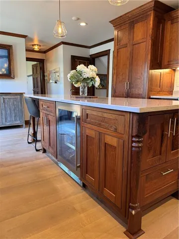 a kitchen with stainless steel appliances granite countertop a sink and cabinets