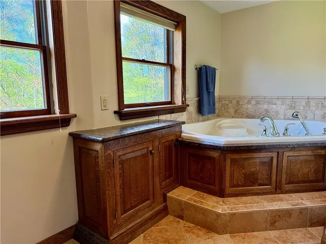 a bathroom with a sink and a window