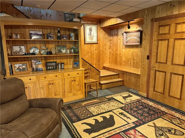 a living room with furniture and a rug