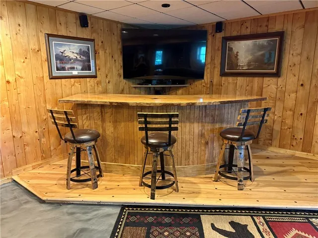 a living room with fireplace furniture and a flat screen tv