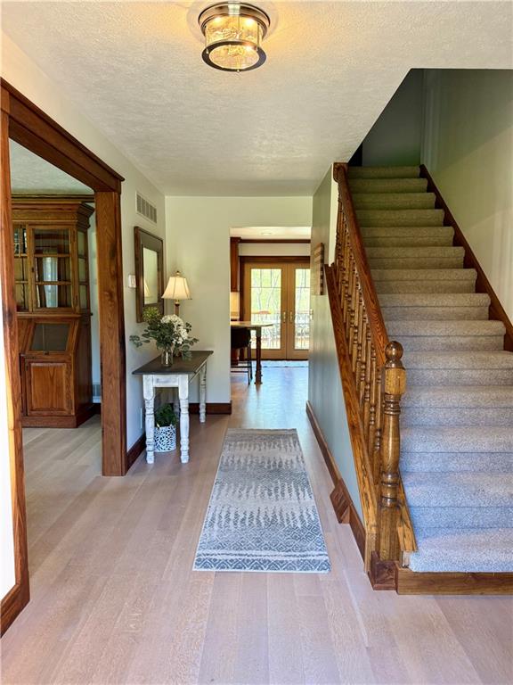 111 McCall Road Butler, PA 16001 - Photo 7 of 50 a view of entryway and hall with wooden floor