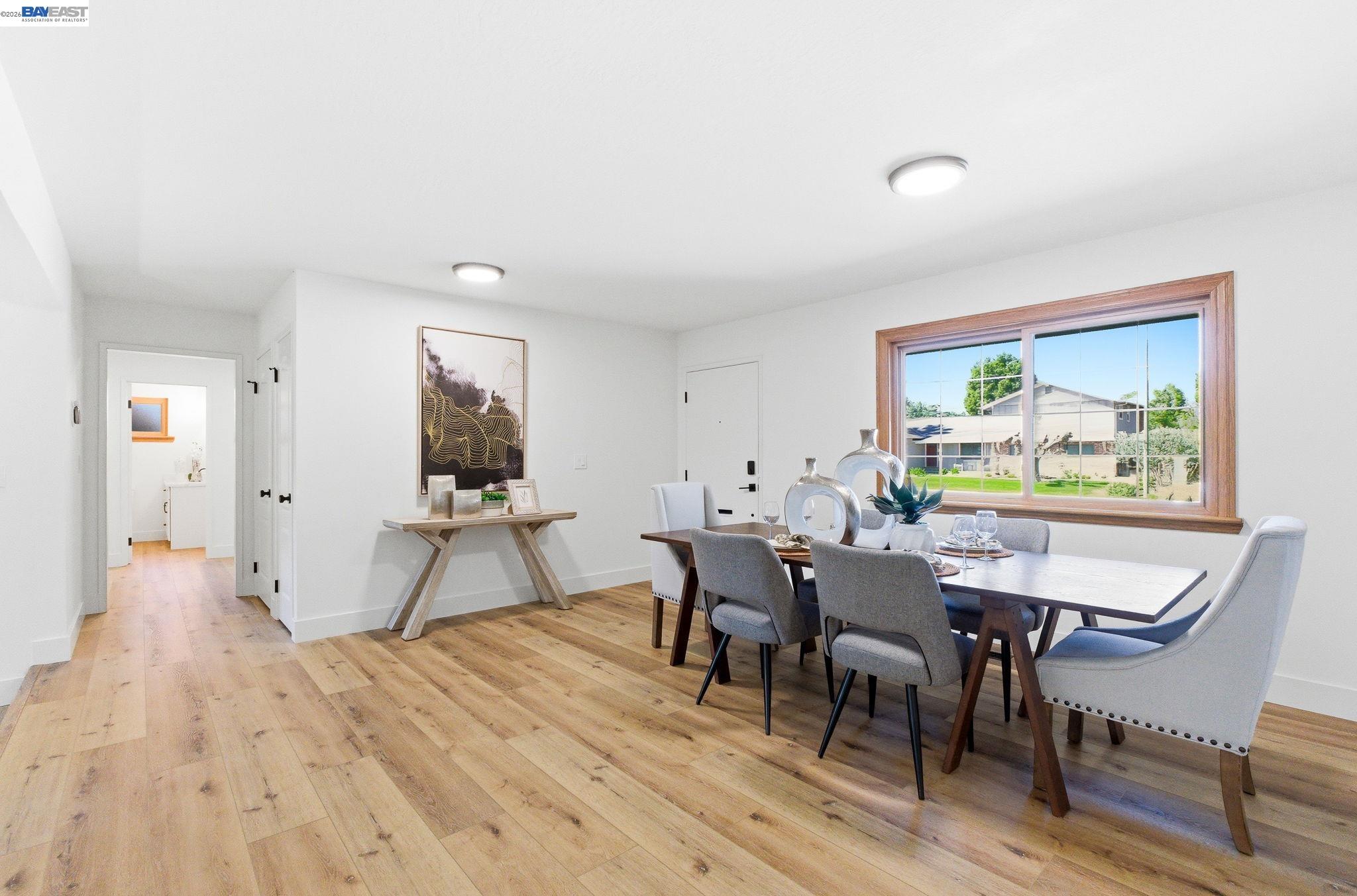 2645 Swanson Way Mountain View, CA 94040 - Photo 11 of 50 a view of a dining room with furniture and a wooden floor