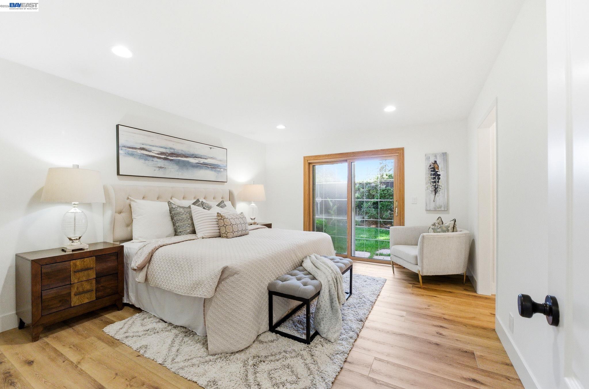 2645 Swanson Way Mountain View, CA 94040 - Photo 16 of 50 a bedroom with a bed and wooden floor