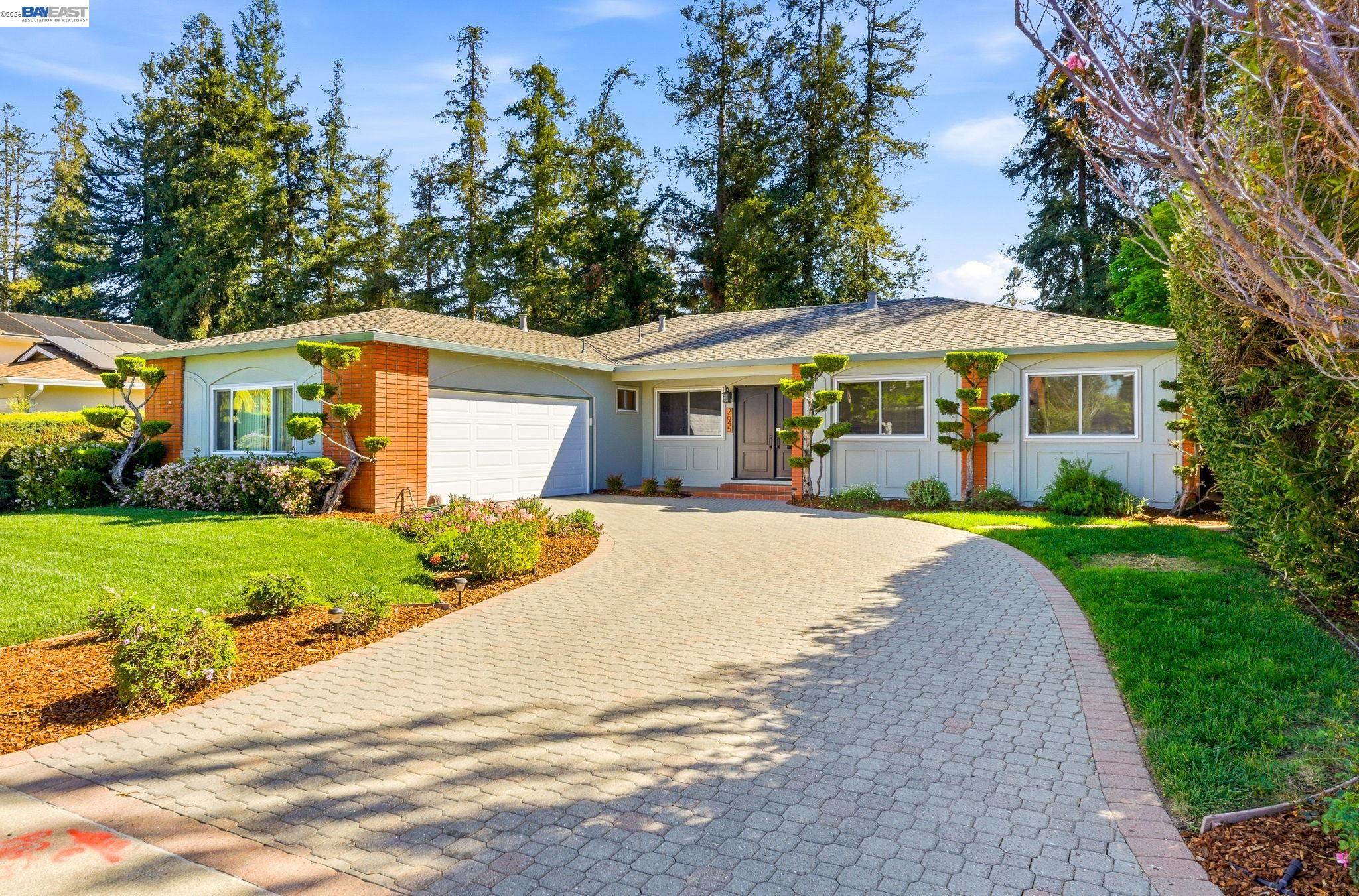 2645 Swanson Way Mountain View, CA 94040 - Photo 2 of 50 a front view of a house with a yard and trees