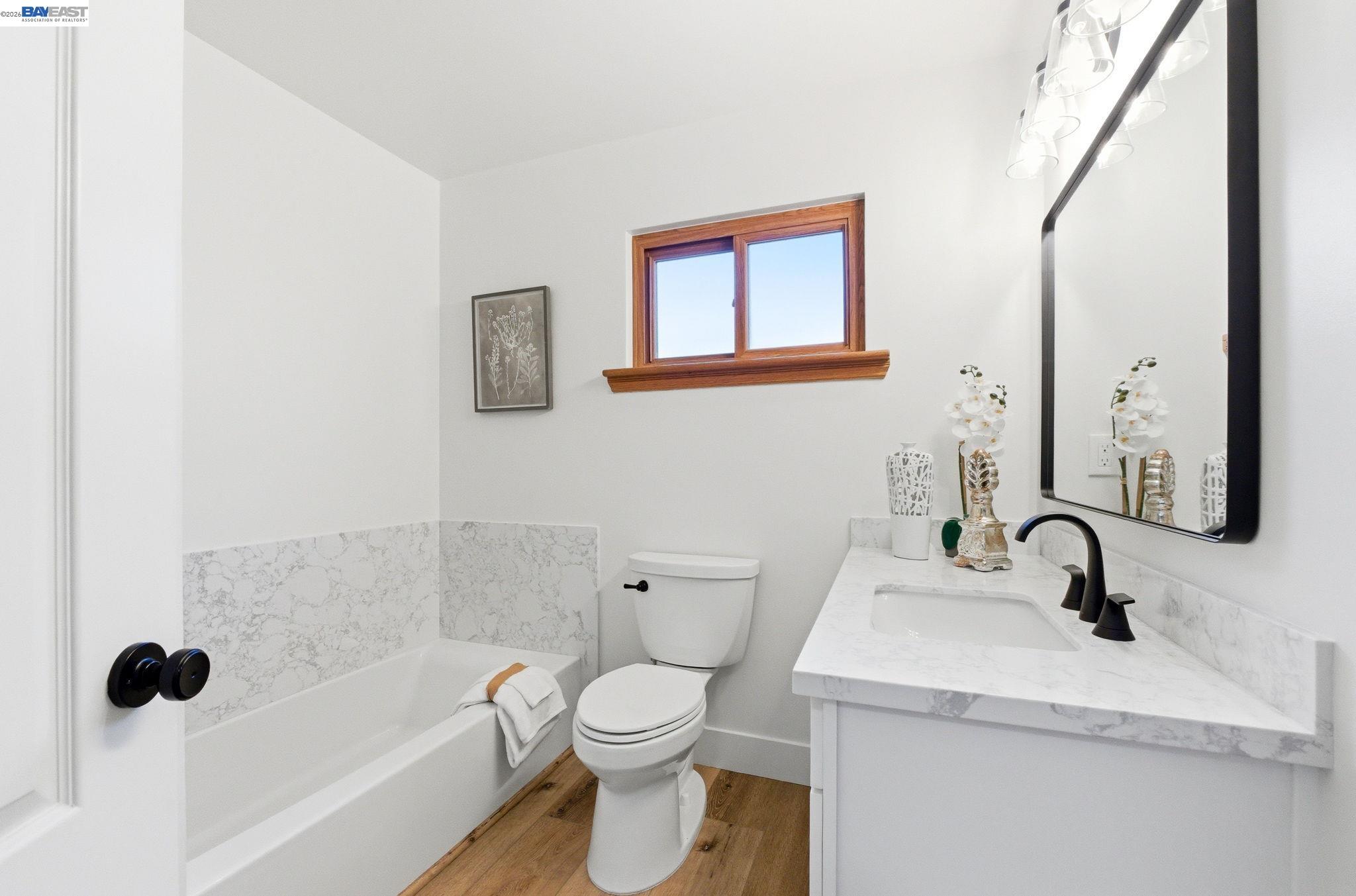 2645 Swanson Way Mountain View, CA 94040 - Photo 21 of 50 a bathroom with a toilet sink and mirror