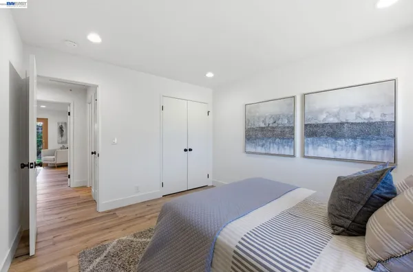 a bedroom with a bed and a table in it